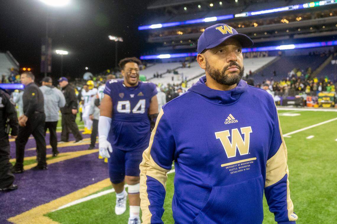 Washington head coach Jimmy Lake walks off the field after the Huskies fell to Oregon, 26-16, in a Pac-12 game at Husky Stadium in Seattle.