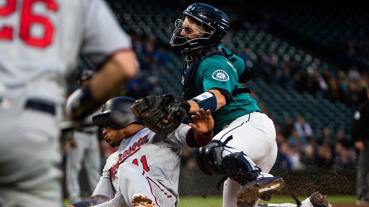 Twins shortstop Jorge Polanco slides safely across the plate in the fifth inning after Tom Murphy wasn’t able to control the ball. The Seattle Mariners played the Minnesota Twins in a Major League Baseball game at T-Mobile Park in Seattle, Wash., on Friday, May 17, 2019.