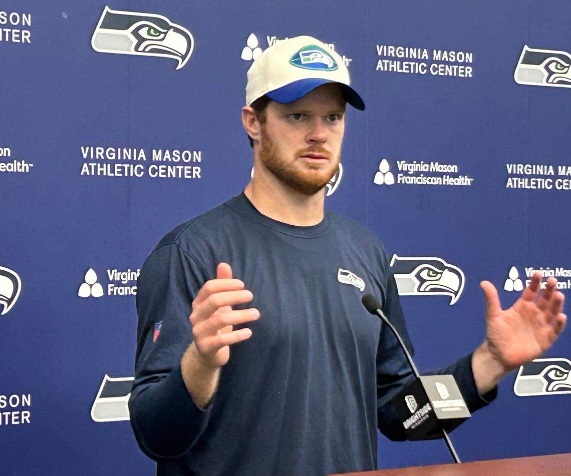 New Seahawks quarterback Sam Darnold talks to reporters following the fifth practice of Seattle’s organized team activities (OTAs) at the Virginia Mason Athletic Center in Renton June 4, 2025.