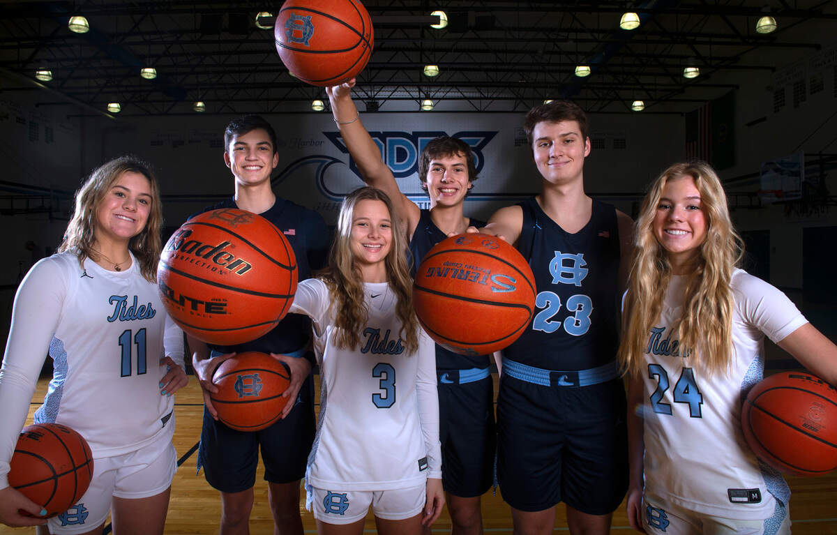 Gig Harbor basketball players (from left) Riley Peschek, Will Landram, Taylor Schwab, Asher Raquiza, Luke Browne and Baylee Young are leading their respective basketball teams to the top of the 3A South Sound Conference standings.The players are shown at Gig Harbor High School in Gig Harbor, Washington, on Tuesday, Jan. 11, 2022.