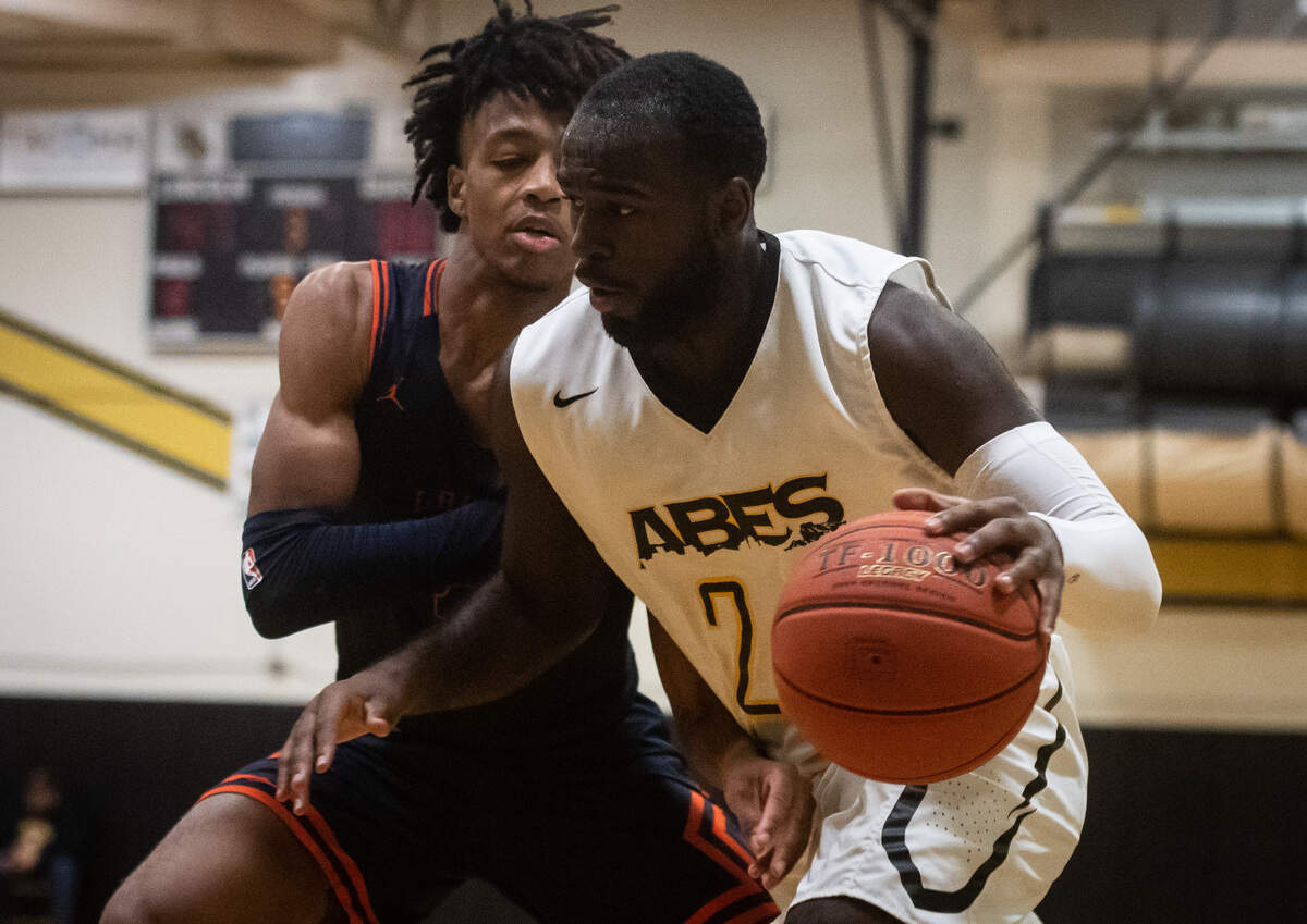 Lincoln’s Julien Simon works against Lakes’ Jordan McCray during the third quarter. Lakes played Lincoln in a basketball game at Lincoln High School in Tacoma, Wash., on Friday, Jan. 10, 2020.