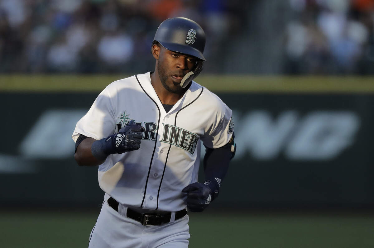 Seattle Mariners' Guillermo Heredia rounds the bases through a patch of sunlight after he hit a solo home run against the San Francisco Giants during the third inning of a baseball game Tuesday, July 24, 2018, in Seattle. (AP Photo/Ted S. Warren)