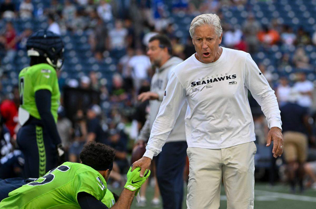 Seahawks head coach Pete Carroll hypes up players during warm-ups before the mock game at Lumen Field, Friday, Aug. 4, 2023.