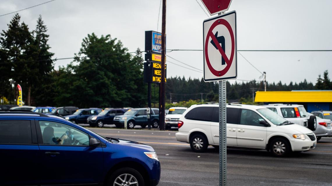 A sign showing no left turns is seen at the exit of the Walmart in Spanaway, Wash., on Saturday, Sept. 15, 2018.