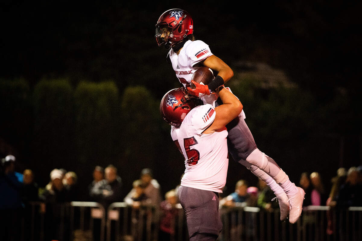 Kennedy Catholic’s George Klewin and Junior Alexander celebrate a touchdown in the second quarter. Kennedy Catholic played Enumclaw in a football game at the Enumclaw Expo Center in Enumclaw, Wash., on Friday, Oct. 4, 2019.