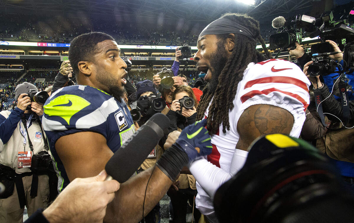 Seahawks linebacker Bobby Wagner and former teammate Richard Sherman of San Francisco playfully jaw at each other after Seattle’s decisive 43-16 victory. The Seattle Seahawks played the San Francisco 49ers in a NFL football game at CenturyLink Field in Seattle, Wash., on Sunday, Dec. 2, 2018.