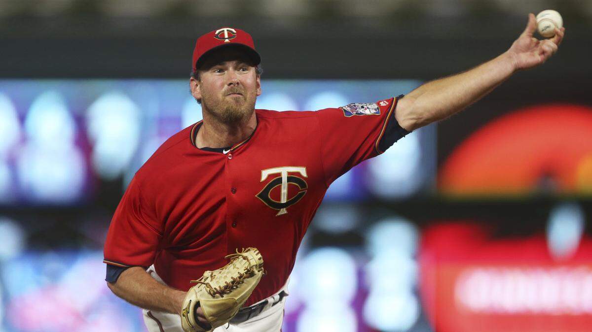 Minnesota Twins pitcher Zach Duke, shown throwing against the Tampa Bay Rays earlier in July, was traded to the Seattle Mariners on Monday.