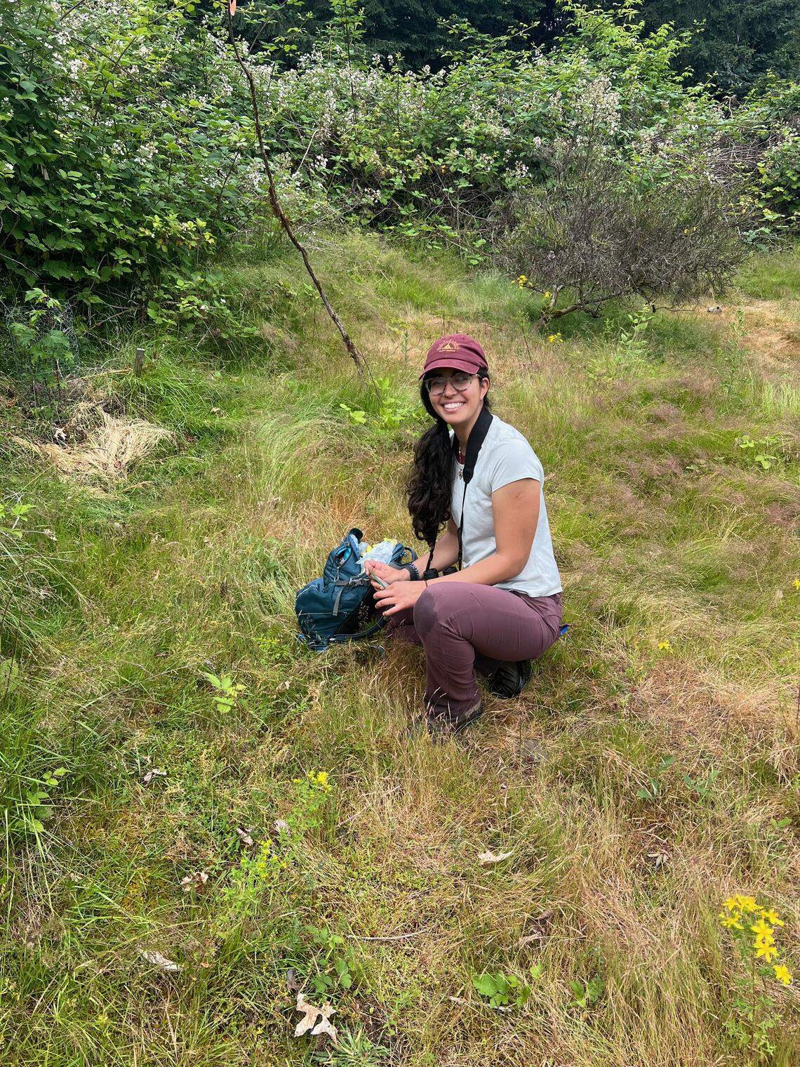 Yasmine Hentati collecting samples in the field.