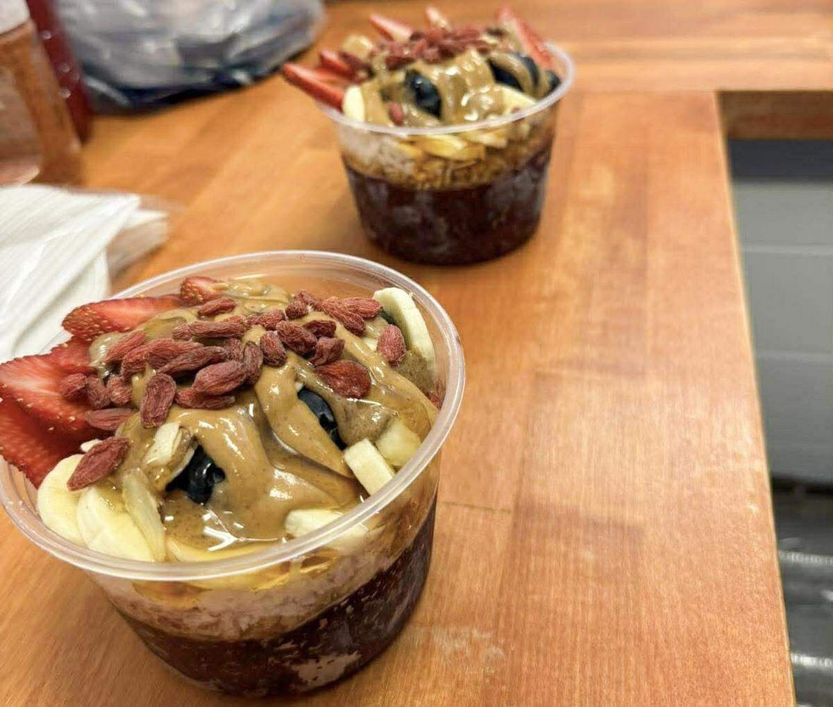 Acai bowls come with a wide variety of toppings, plus a drizzle of honey and a choice of almond or peanut butter.