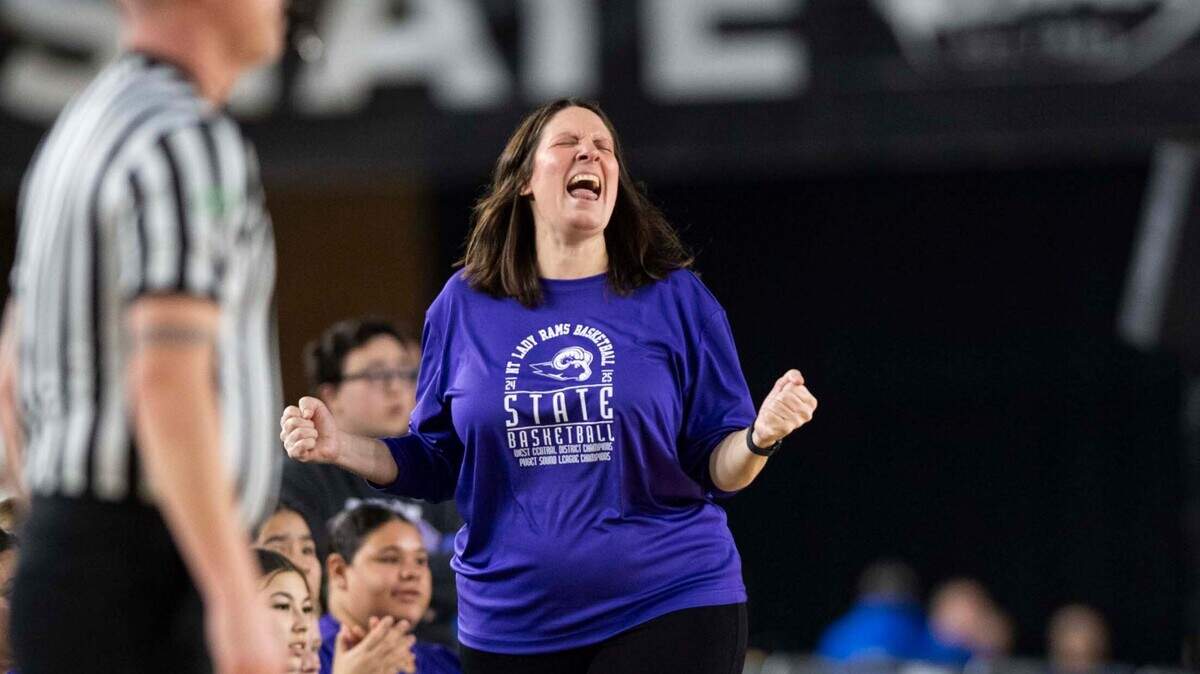 North Thurston head coach Jackie Meyer celebrates after a Bellevue turnover during the first half of a Class 3A state basketball tournament first-round game at the Tacoma Dome on Thursday, March 6, 2025, in Tacoma, Wash.