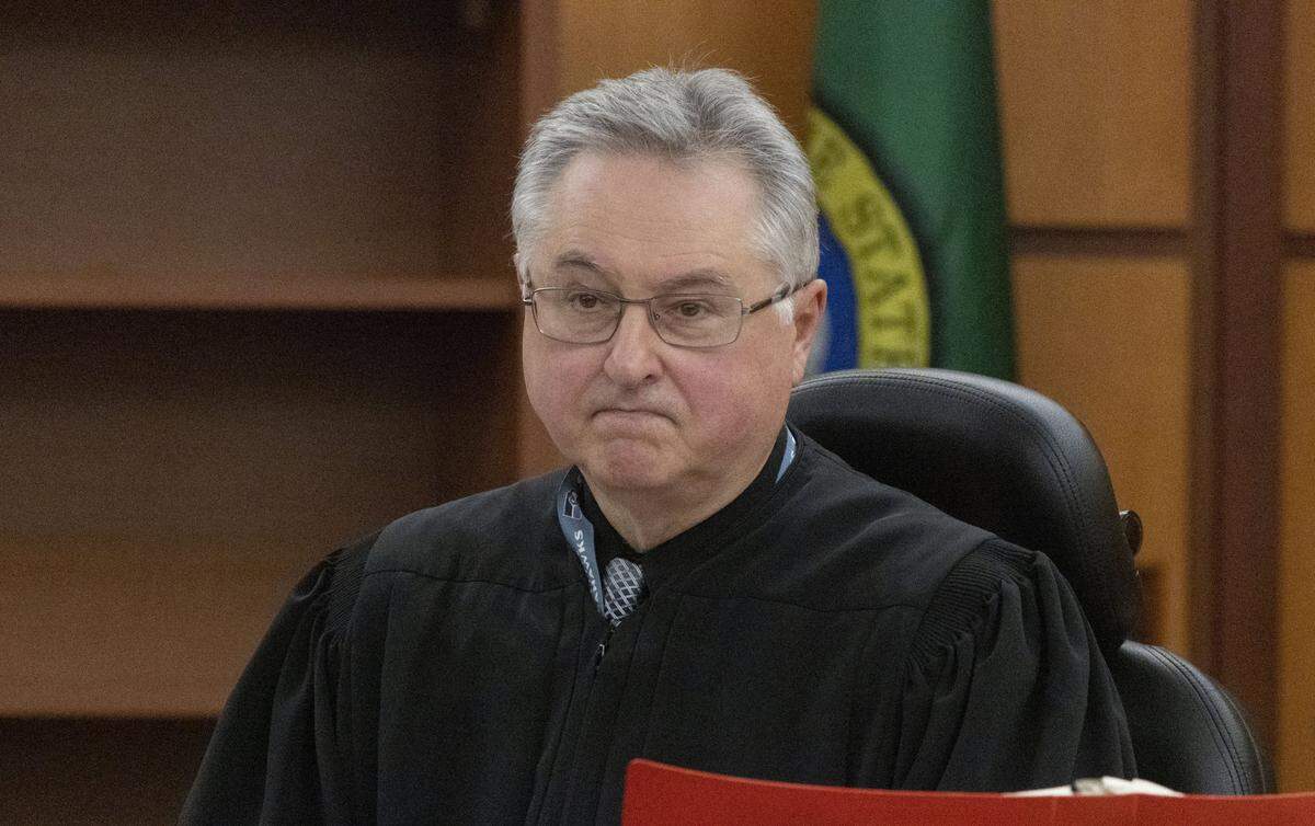 Pierce County Judge Bryan Chushcoff looks at attorneys in the Manny Ellis case before reading the verdict in Pierce County Superior Court Thursday, December 21, 2023. The three officers who were accused, Timothy Rankine, Christopher ÒShaneÓ Burbank and Matthew Collins were all found not guilty.