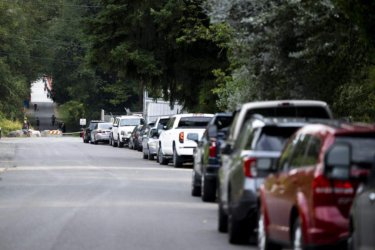 Cars line the streets and lots near the Foothills Trail Bridge as the White River Bridge remains closed on Wednesday, Aug. 27, 2025, in Buckley, Wash. The Foothills Bridge over the White River is the only thing connecting the towns of Buckley and Enumclaw.