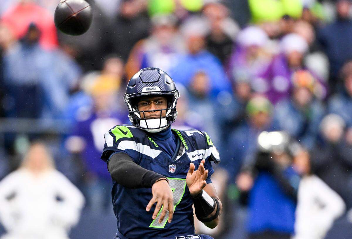 Seattle Seahawks quarterback Geno Smith (7) throws to cornerback Coby Bryant (8) during the second quarter of the game against the Minnesota Vikings at Lumen Field, on Sunday, Dec. 22, 2024, in Seattle, Wash.