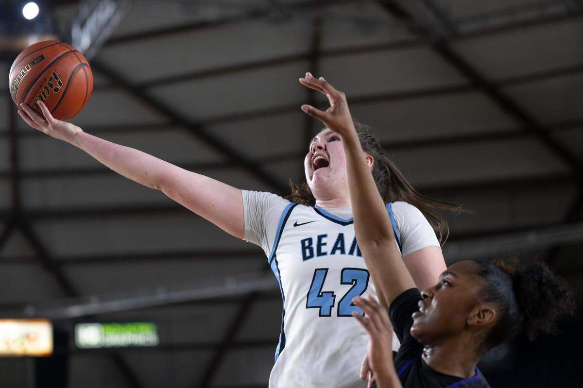 Central Valley forward Brynn McGaughy (42) attempts a layup as Garfield forward Star Smiley (1) defends during the third quarter of a Class 3A state basketball tournament semifinal game at the Tacoma Dome on Friday, March 7, 2025, in Tacoma, Wash.