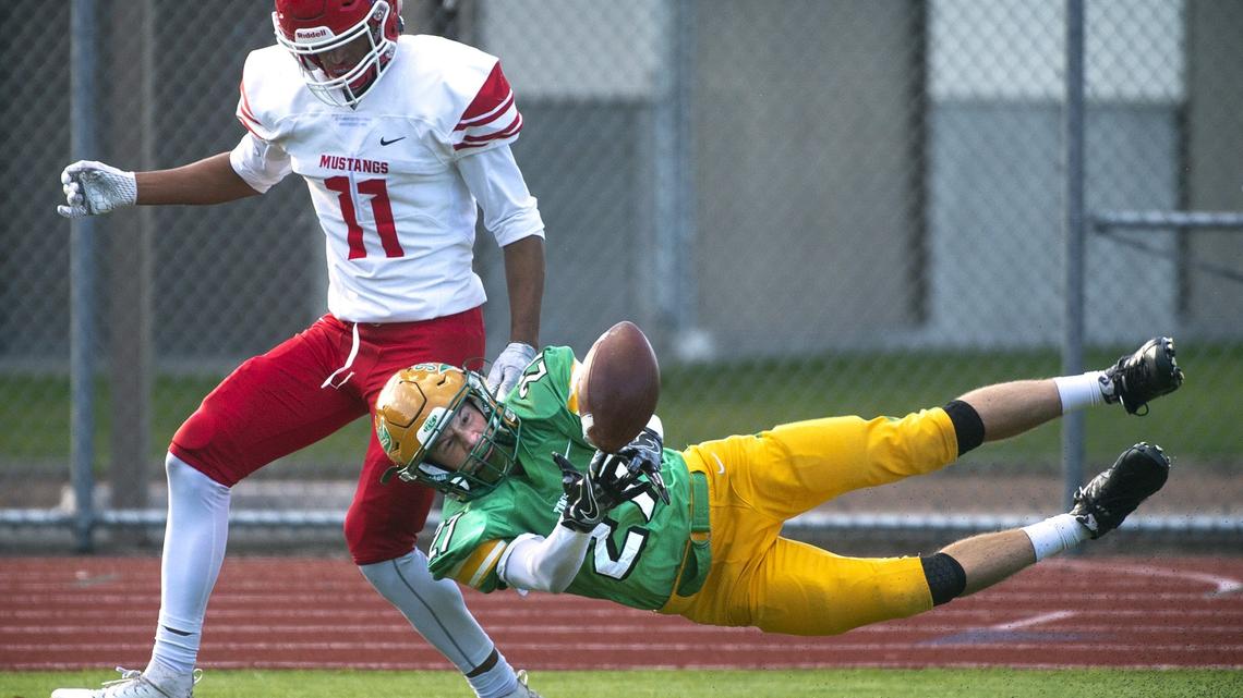 Tumwater defensive back Patrick Williams goes horizontal to break up a fourth-down pass in front of Prosser wide receiver Will Thompson during Saturday afternoon’s 2A football state playoff game at Tumwater District Stadium in November 2018.