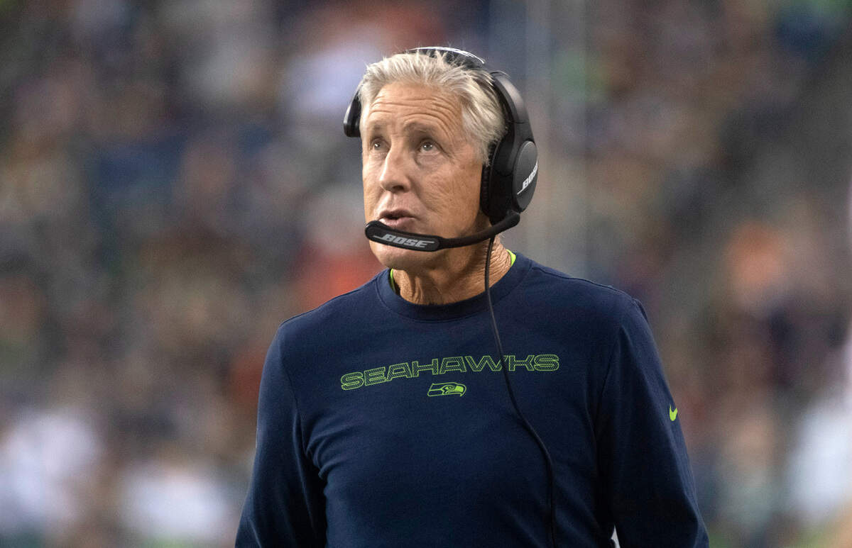 Seahawks head coach Pete Carroll watches a replay of a lost Seahawks fumble during Saturday night’s NFL preseason football game against the Denver Broncos at Lumen Field in Seattle, Washington, on Saturday, Aug. 21, 2021.