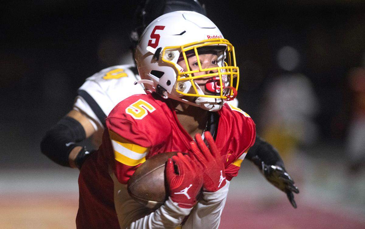 Mount Tahoma wide receiver Deonjae Ervin pulls in a touchdown pass in front of Lincoln defensive back Jemani Teplasy during Friday night’s football game at Mount Tahoma High School in Tacoma, Washington, on Sept. 20, 2023. Mount Tahoma won the game, 24-20.