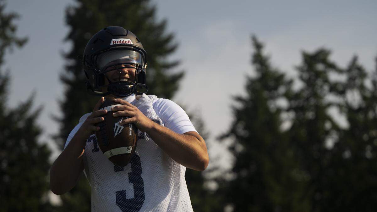 Gig Harbor quarterback Sawyer Hayes throws during a football practice at Gig Harbor High School on Tuesday, Aug. 26, 2025, in Gig Harbor, Wash.