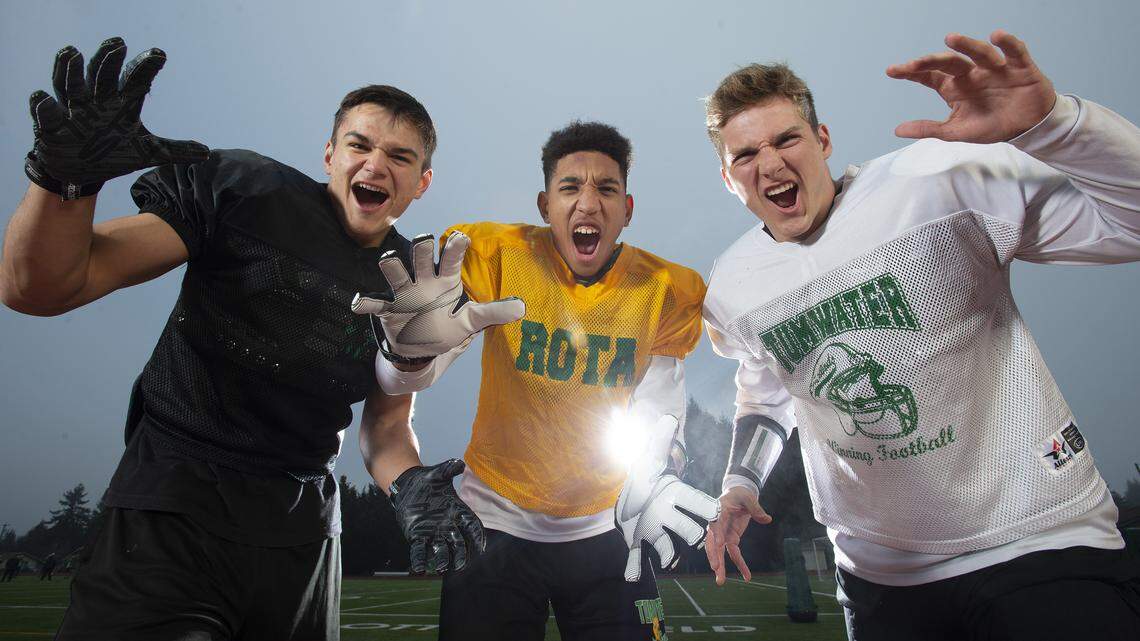 Tumwater senior defenders (from left) Gaven Murphy, Jaylen Clay and Tyler Woods are leading a stingy T-Bird defense. They are shown during football practice at Tumwater District Stadium on Thursday, Nov. 21, 2019.