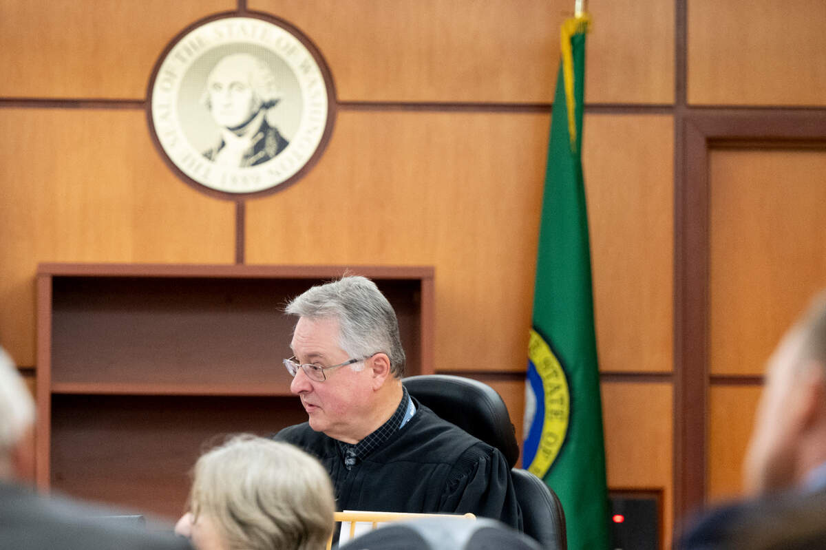 Judge Bryan Chushcoff ask questions of a single juror as jury issues arise during deliberation in the trial of three Tacoma police officers in the killing of Manny Ellis at Pierce County Superior Court, Monday, Dec. 18, 2023.