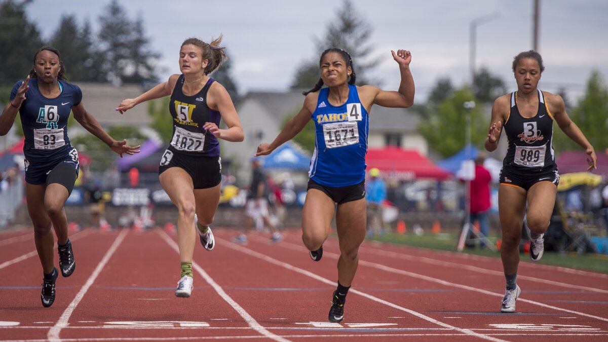 
Aliya Wilson of Tahoma, second from right, edges Aulane Mpuli of Auburn Riverside, left, Skyler Walton of Wenatchee and Anna Rogers of Lewis & Clark, right, in the 4A girls 100-meter dash at the state championships Saturday at Mount Tahoma High School.
