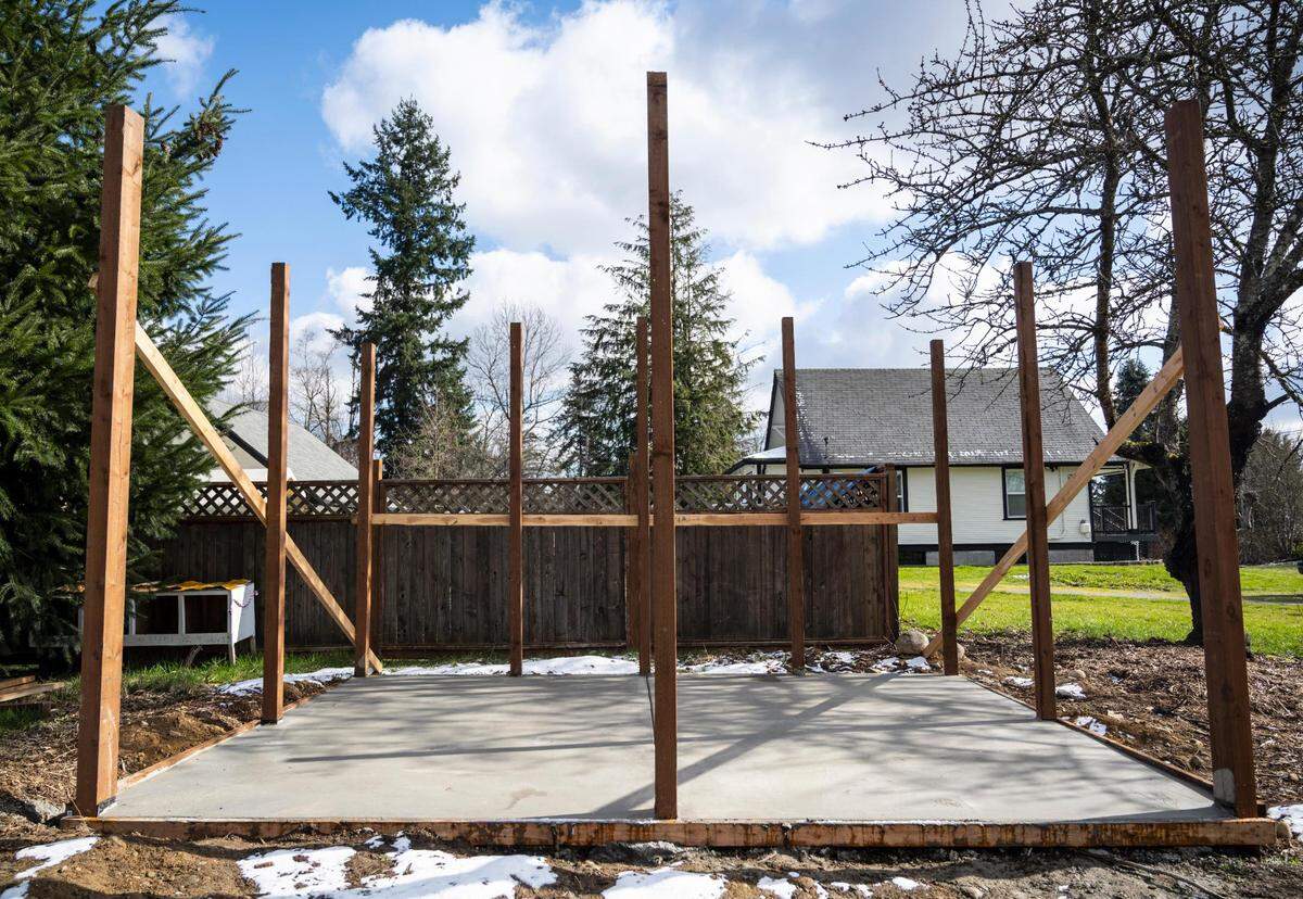 A shed is in the process of being built at the farm on Thursday, Feb. 24, 2022, in Tacoma, Wash. Rose Island Farm is an Indigenous-owned family farm that provides skill share workshops, food and herbal supports for the BIPOC community.