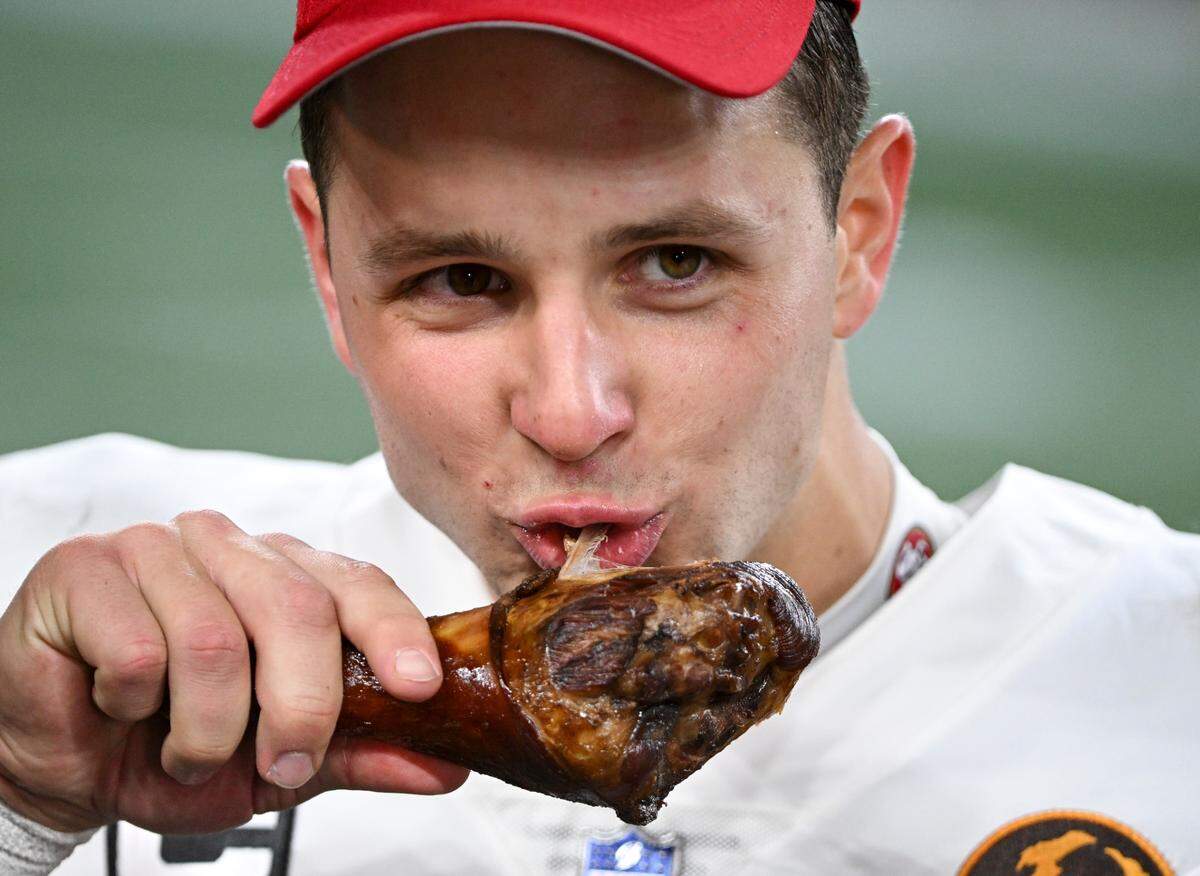 San Francisco 49ers quarterback Brock Purdy (13) eats a turkey leg after the 49ers 31-13 victory against the Seattle Seahawks at Lumen Field, Thursday, Nov. 23, 2023, in Seattle, Wash.