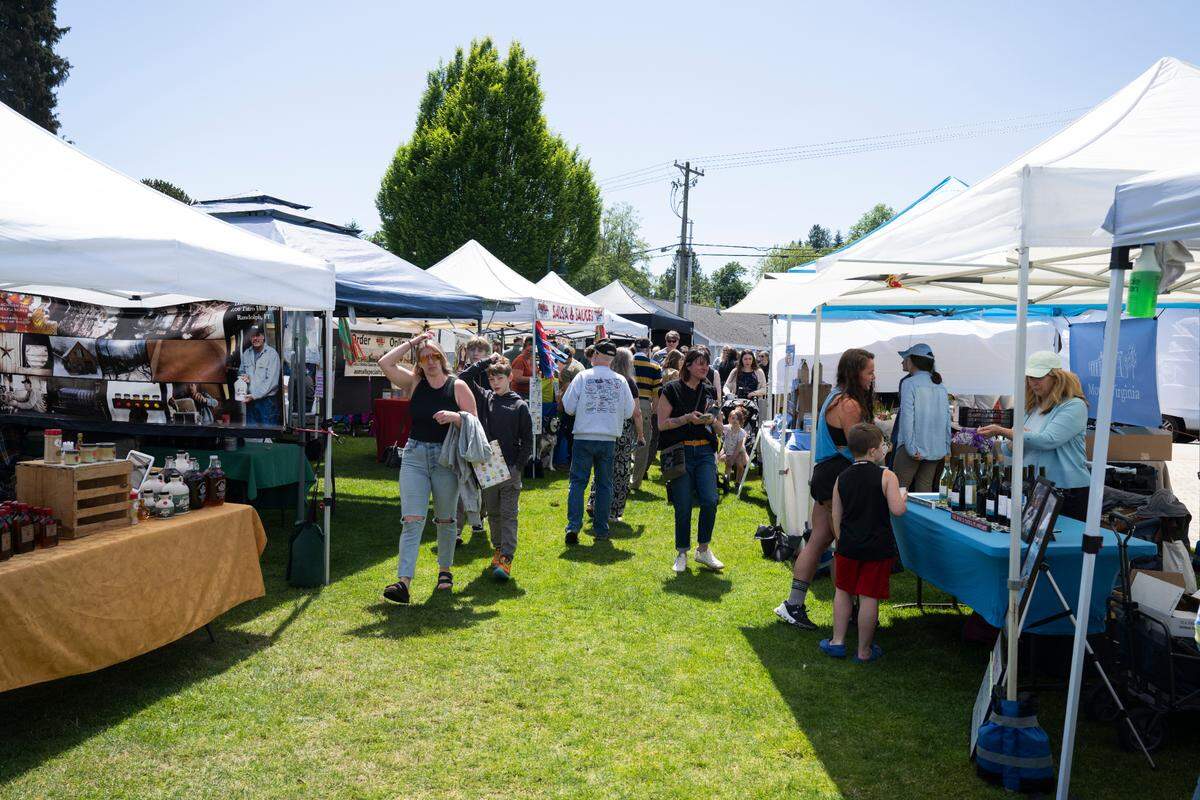 Vendors fill Skansie Brothers Park and Netshed for Waterfront Farmers Market, on Thursday, May 22, 2025, in Gig Harbor, Wash. The market is one of many summer events that draws tourists to the Gig Harbor waterfront.