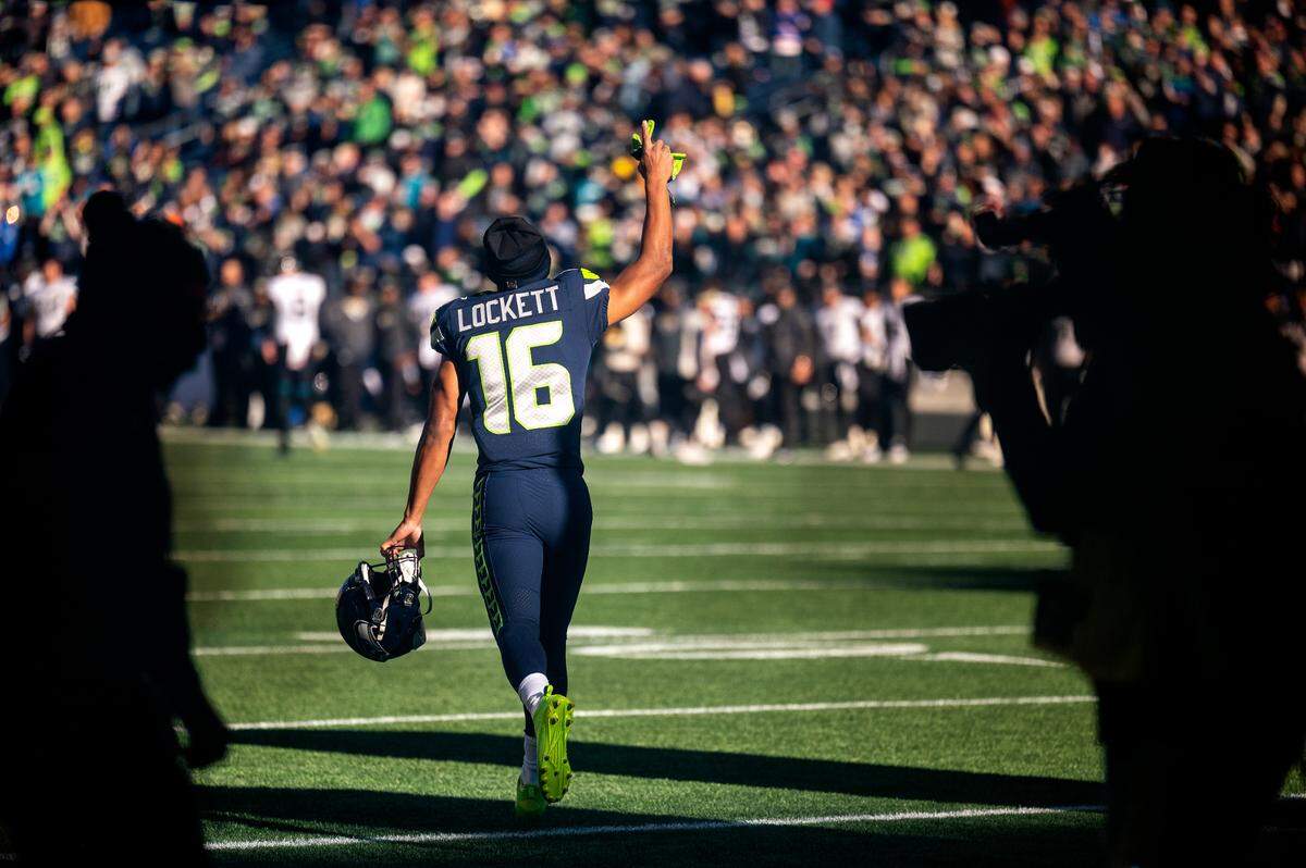 Seattle Seahawks wide receiver Tyler Lockett (16) is introduced prior to kickoff against the Jacksonville Jaguars on Sunday at Lumen Field in Seattle.