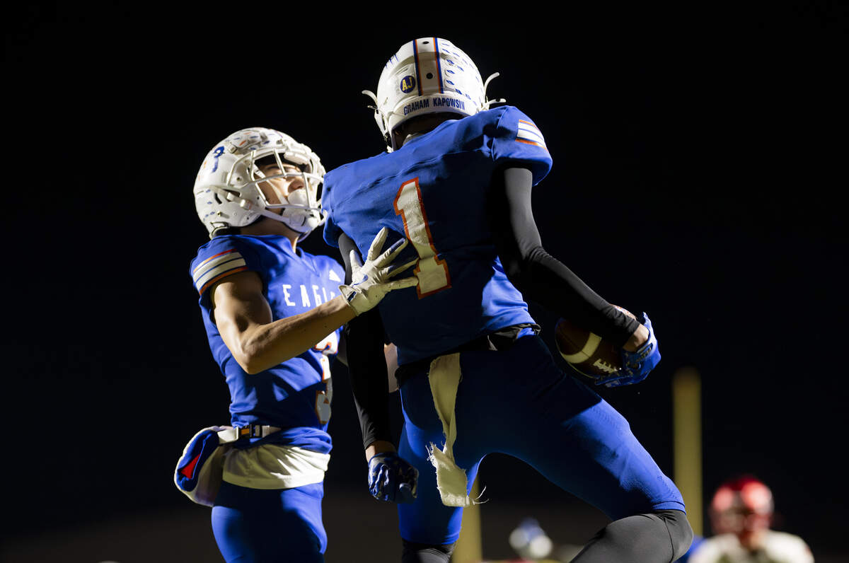 Graham-Kapowsin wide receiver Jayce Halasz (1) celebrates his touchdown with wide receiver Keh'ano Corpuz (3) during the first half of the opening round 4A state tournament game at Art Crate Field, on Saturday, Nov. 15, 2025, in Spanaway, Wash.