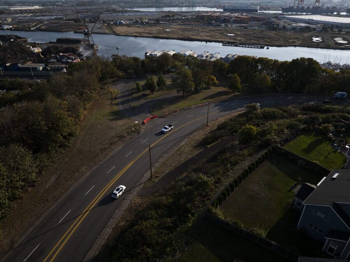 Cars drive along Norpoint Way NE, on Monday, Oct. 6, 2025, in Tacoma, Wash. Residents say that the stretch of road and the adjacent Marine View Drive are dangerous and prone to speeding and car crashes.