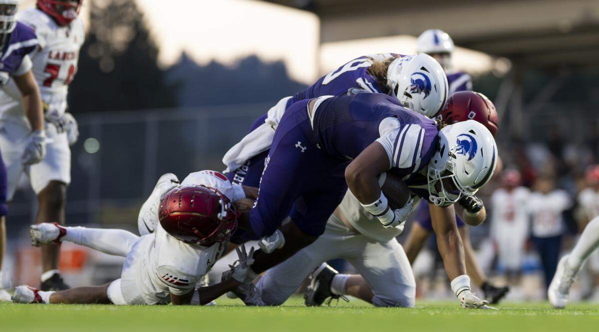 Sumner running back Lance McGee (9) bowls into the end zone against Kennedy Catholic Lancers during the first half of the game at Sunset Chev Stadium on Friday, Sept. 12, 2025, in Sumner, Wash.