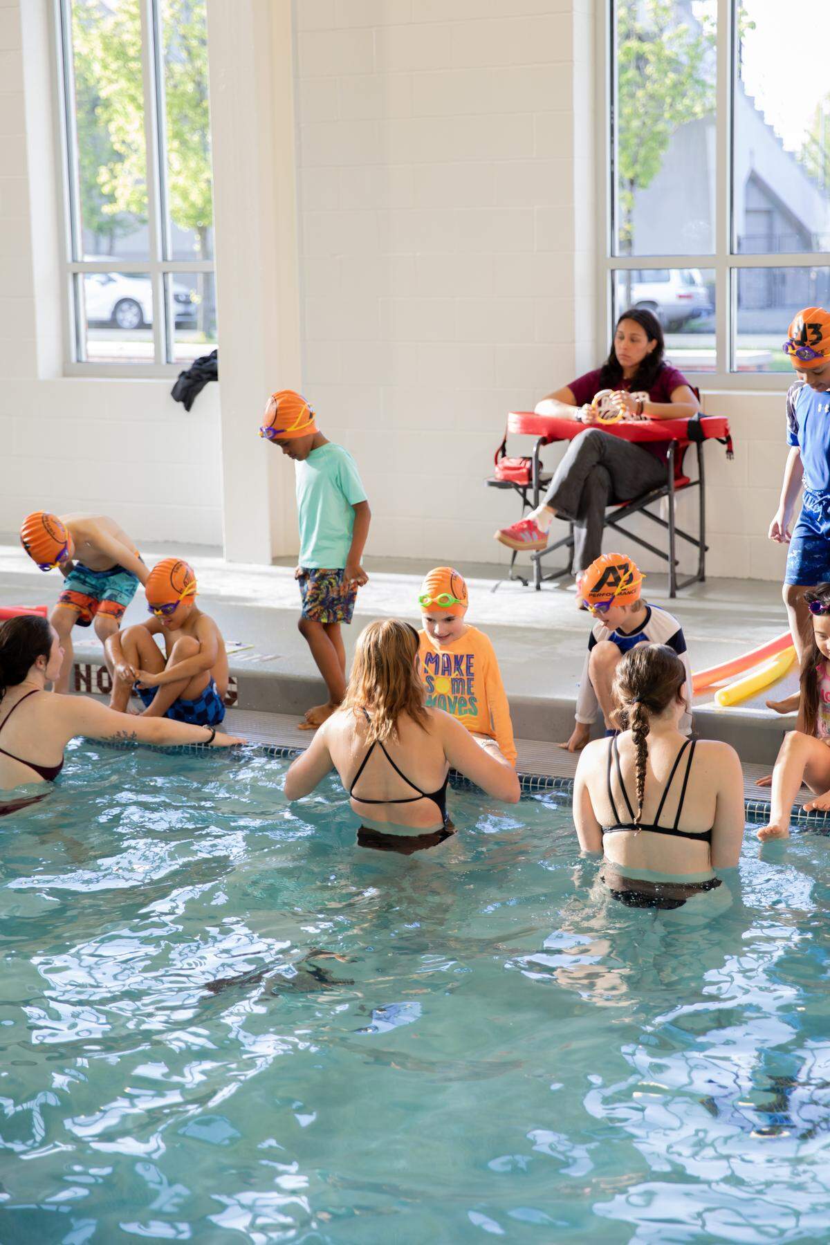 The University of Puget Sound’s swim team partnered with No More Under in 2025 to provide free swimming lessons for dozens of local children.