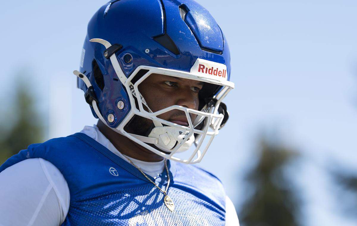Curtis offensive lineman Jereme Scott runs drills during a football practice at Curtis Senior High school on Thursday, Aug. 21, 2025, in University Place, Wash.