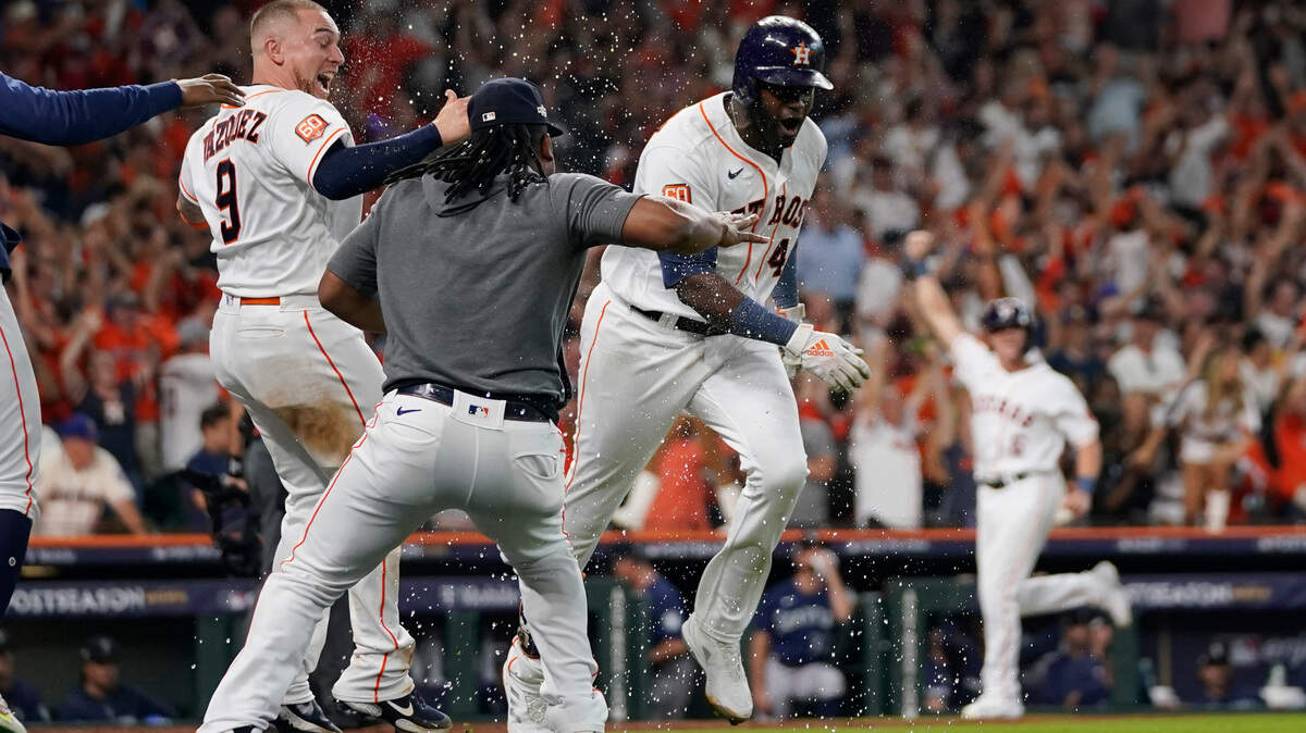 Houston Astros designated hitter Yordan Alvarez (44) celebrates with teammates after his three-run, walkout home run against the Seattle Mariners during the ninth inning in Game 1 of an American League Division Series baseball game in Houston,Tuesday, Oct. 11, 2022. (AP Photo/David J. Phillip)