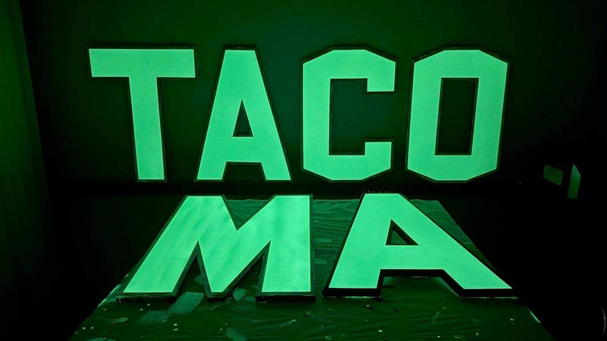 John James Nelson, the artist behind the ‘TACOMA’ sign at Titlow Beach, shares a photo of what the sign will look like after a new coat of glow-in-the-dark paint.