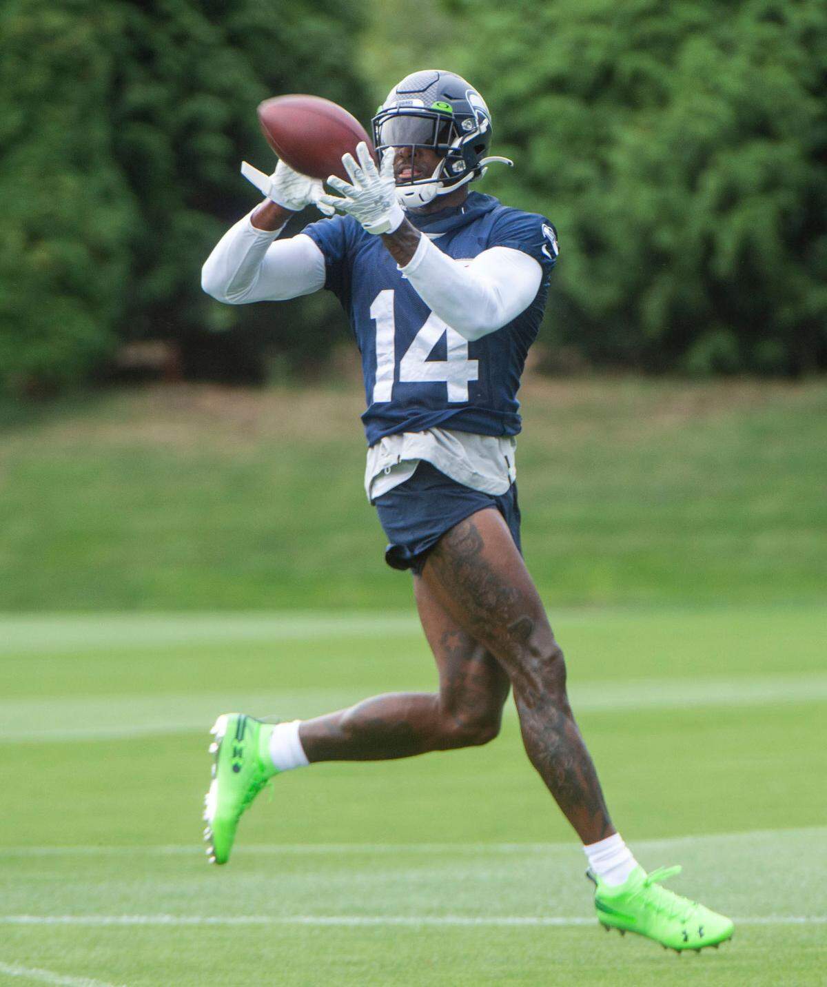 Seattle receiver DK Metcalf hauls in a pass from quarterback Russell Wilson on the fourth day of Seahawks training camp Saturday, July 31, 2021 at the VMAC in Renton.