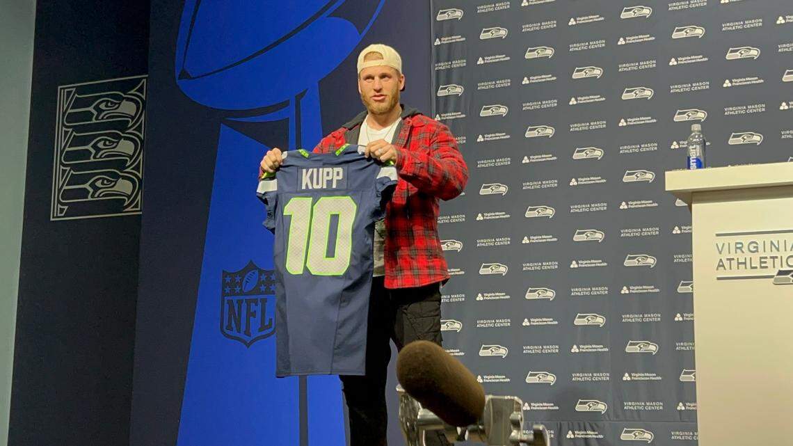 All-Pro wide receiver Cooper Kupp from Yakima displays his new Seahawks jersey number 10 after signing a three-year free-agent contract with Seattle March 18, 2025, at the Virginia Mason Athletic Center in Renton.