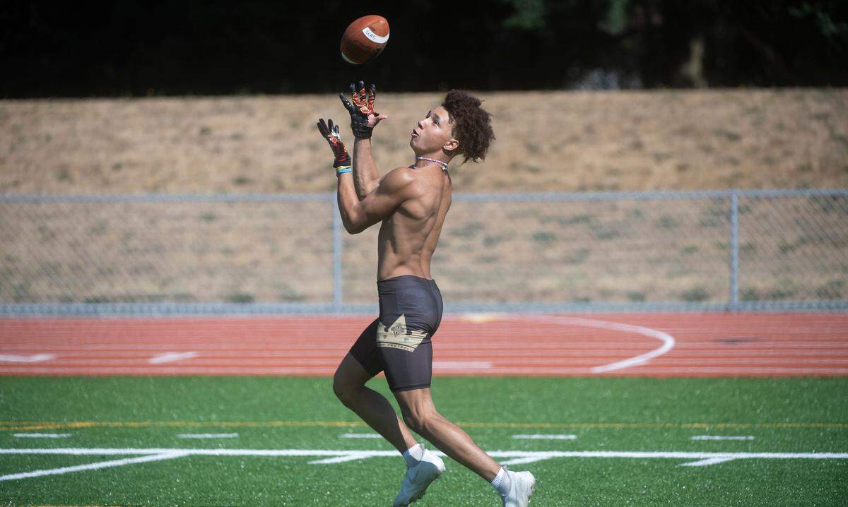 Spanaway Lake wide receiver Jasiah Wagoner pulls in a catch during football practice at Spanaway Lake High School in Spanaway, Washington, on Thursday, Aug. 19, 2021.