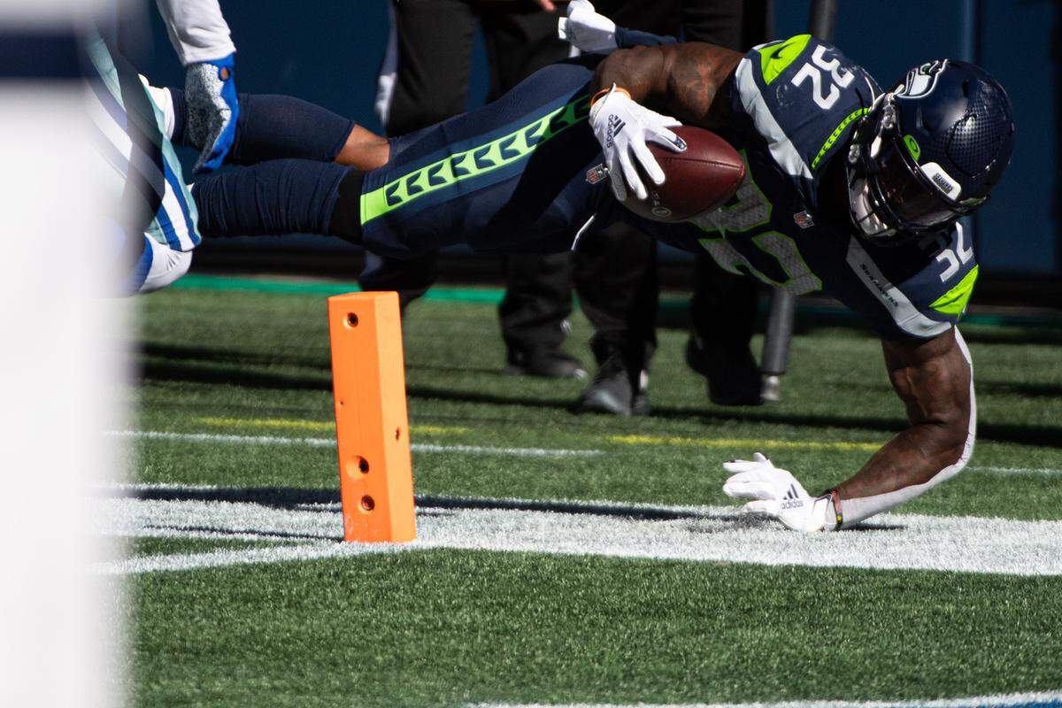Seattle Seahawks running back Chris Carson (32) dives for the pylon but comes up short during the second quarter. The Seattle Seahawks played the Dallas Cowboys in a NFL football game at CenturyLink Field in Seattle, Wash., on Sunday, Sept. 27, 2020.