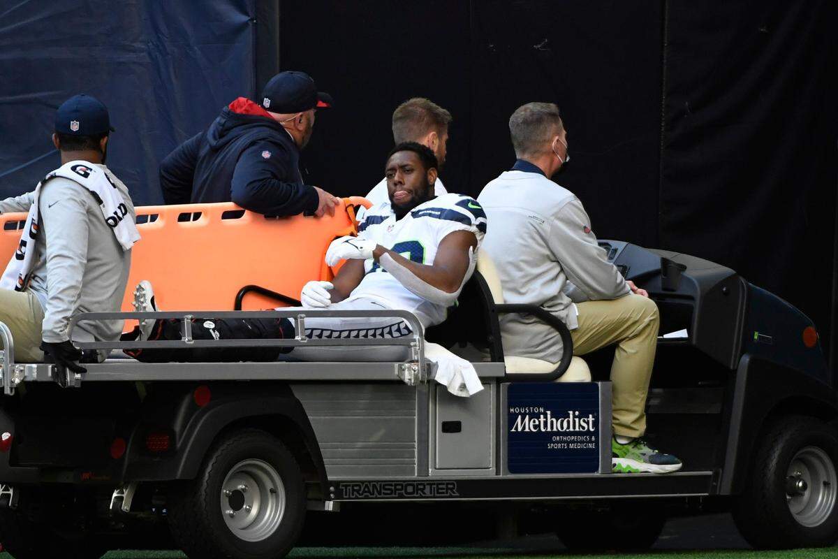Seattle Seahawks defensive back Gavin Heslop (38) is taken off the field after an injury during the second half of an NFL football game against the Houston Texans, Sunday, Dec. 12, 2021, in Houston. (AP Photo/Justin Rex )