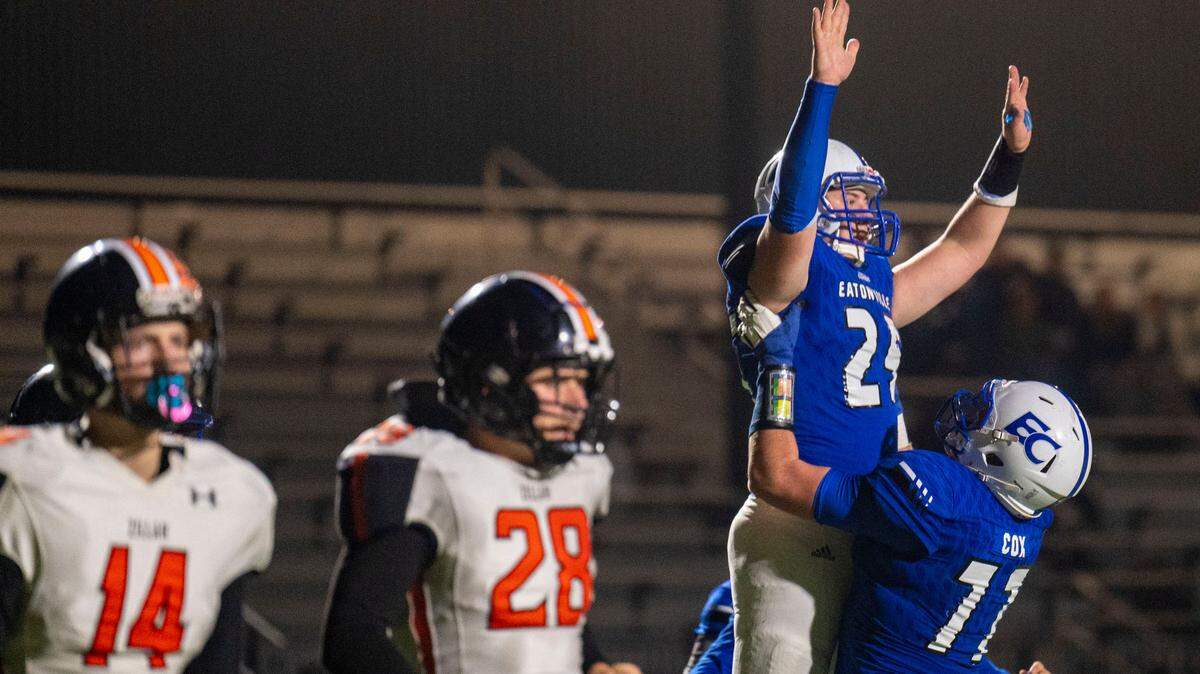 Eatonville’s RJ Schrimpsher is lifted up by Kyle Cox after Schrimpsher found the endzone on a pass from quarterback Job Kralik during the fourth quarter of a State 1A first-round game against Zillah on Friday, Nov. 11, 2022, at Art Crate Field in Spanaway, Wash.