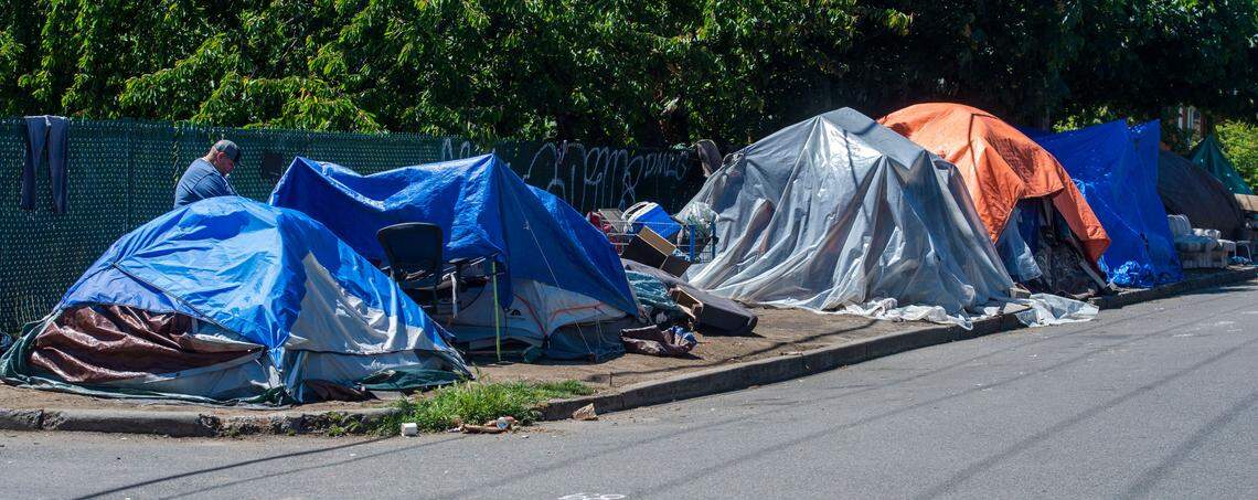 This row of tents is part of sizable homeless encampment near the intersection of North 8th Street and North Yakima Ave in Tacoma on Saturday, May 29, 2021. Per CDC guidelines, the city opted to not clear encampments during the pandemic to prevent possible spread of the disease.