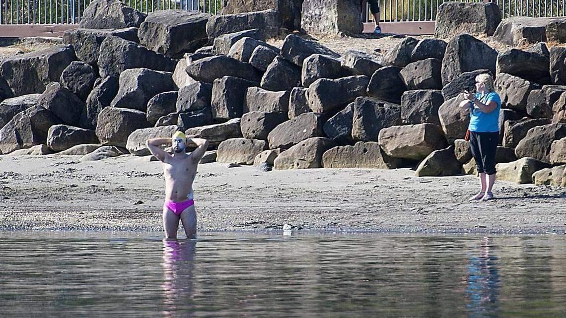 Seattle resident Andrew Malinak pauses for reflection at Jack Hyde Park in Tacoma in 2015, prior to attempting a historic 18.8 mile swim from Tacoma to West Seattle’s Lincoln Park.