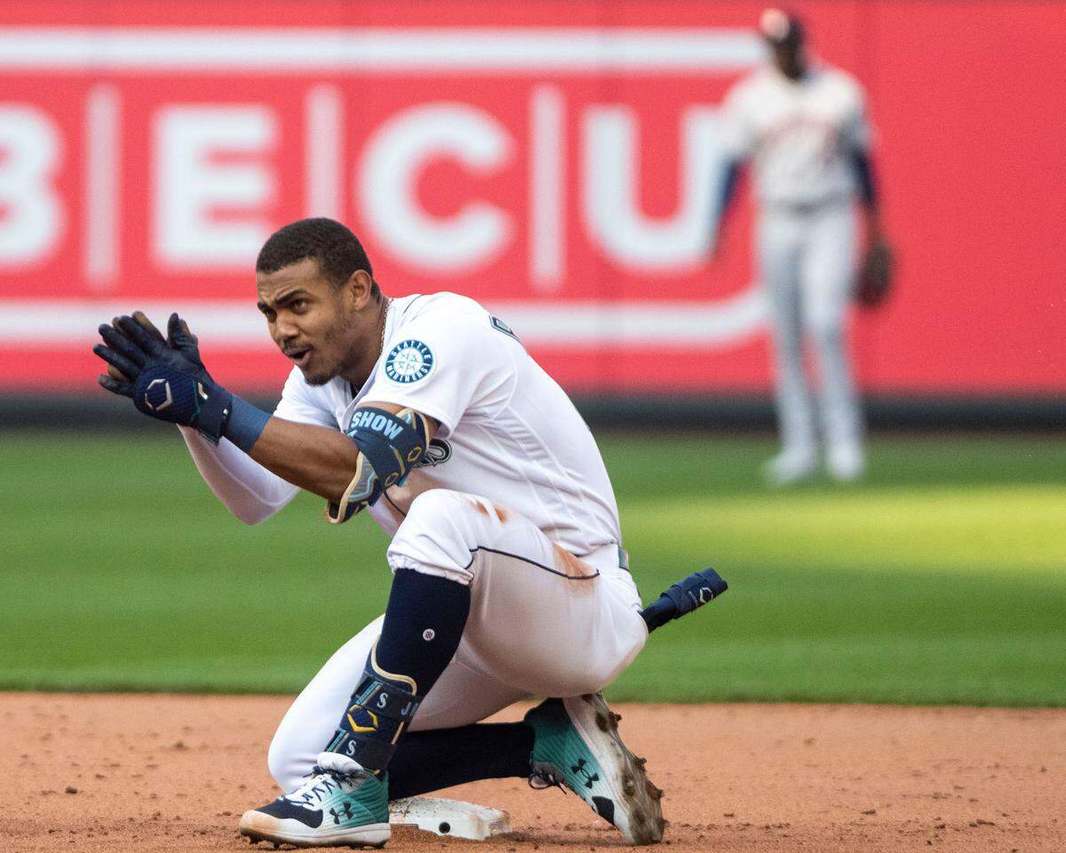 Seattle Mariners center fielder Julio Rodriguez (44) cheers on his team from second base after hitting a double in the bottom of the eighth inning of game 3 of the ALDS against the Houston Astros on Saturday, Oct. 15, 2022, at T-Mobile Park in Seattle.