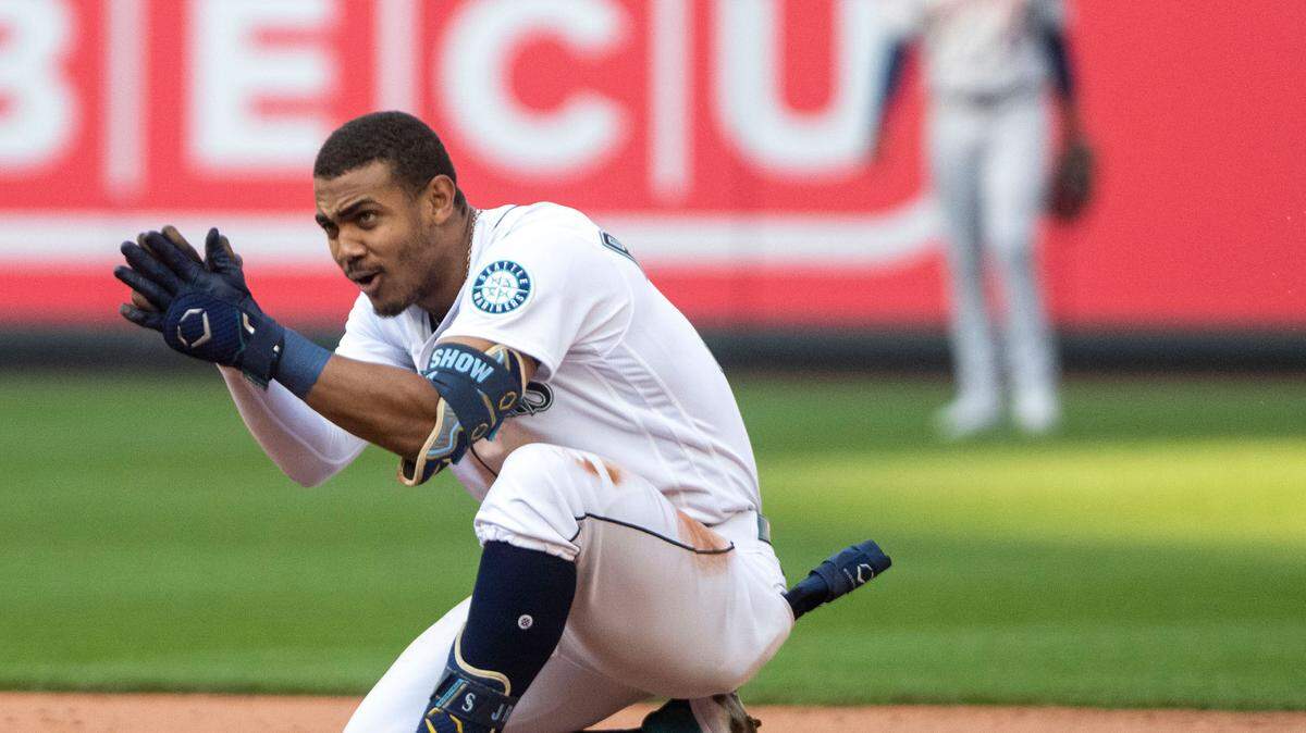 Seattle Mariners center fielder Julio Rodriguez (44) cheers on his team from second base after hitting a double in the bottom of the eighth inning of game 3 of the ALDS against the Houston Astros on Saturday, Oct. 15, 2022, at T-Mobile Park in Seattle.