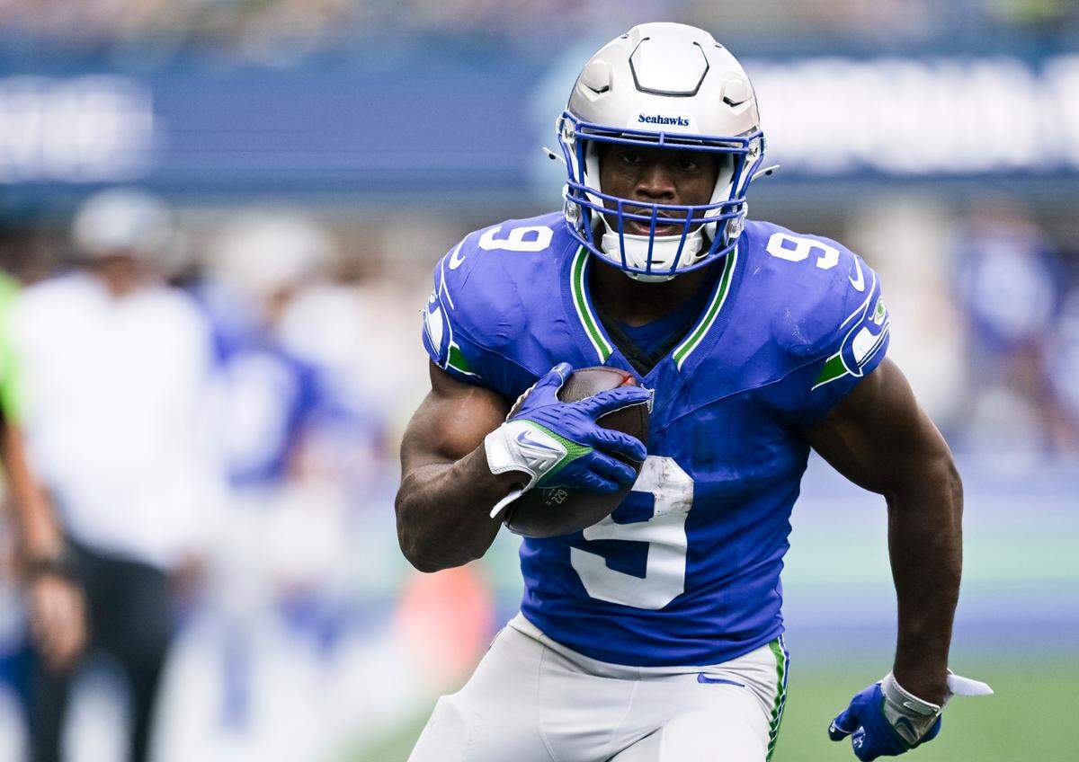 Seattle Seahawks running back Kenneth Walker III (9) runs in a 23-yard touchdown during the third quarter of the game against the Denver Broncos at Lumen Field, on Sunday, Sept. 8, 2024, in Seattle, Wash.