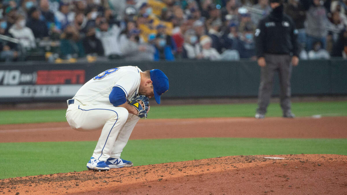 Mariners reliever Anthony Misiewicz slumps down in frustration after giving up a two-run homer in the top of the fourth inning to widen the Angels lead to 6-2 Sunday, Oct. 3 at T-Mobile Park in Seattle.