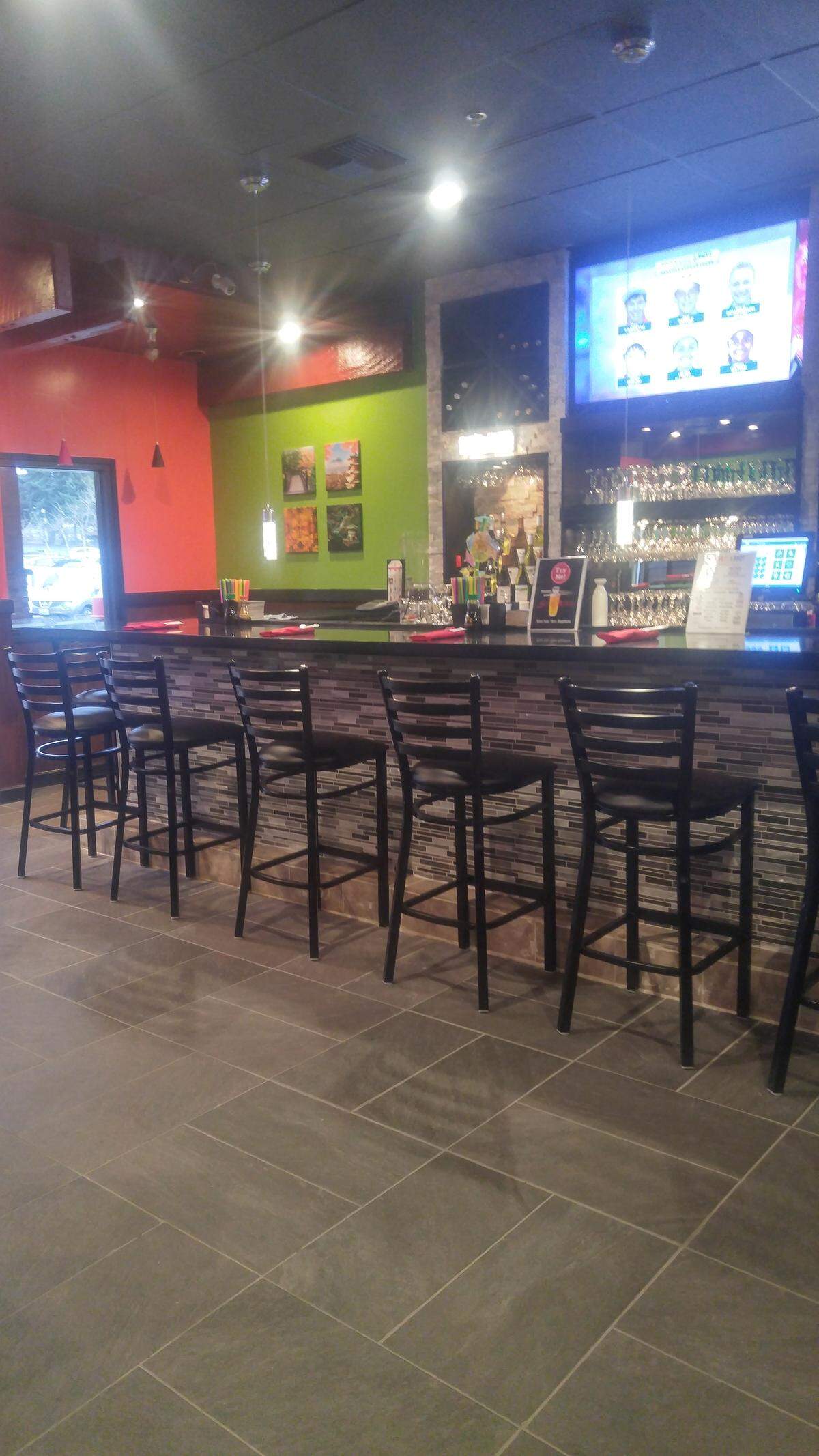 The bar at Sapporo Japanese Steakhouse & Sushi seats more than 20.