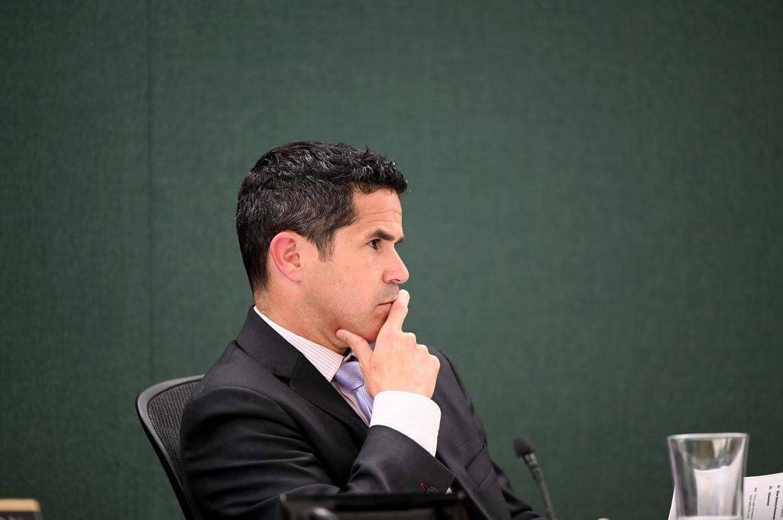 Pierce County Council Chairman Ryan Mello listens to senior legislative assistant Mike Kruger during a Pierce County Council meeting, Tuesday, July 25, 2023, in Tacoma.
